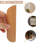Hand holding Six Pack Beech Wood Dresser Handles Cabinet Pulls Semicircle Solid Wood Drawer Knobs for Closet and Kitchen