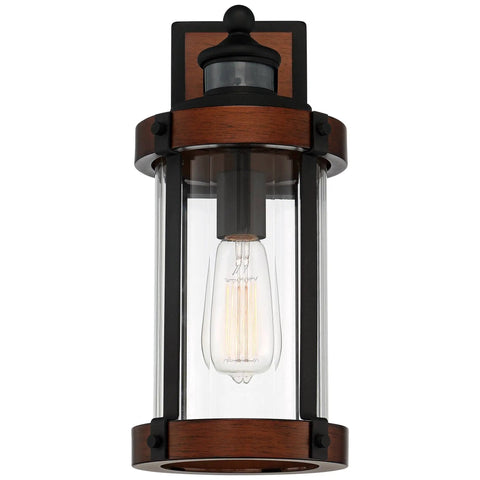 Rock Solid Black Motion Sensor Outdoor Wall Sconce With Zero Fuss Industrial Craftsmanship And Reliable Nighttime Security Lighting For Front Porch Or Driveway, showcasing a metal body with glass shade.