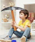 Child holding Foam Pickaxe Prop For Kids Costume And Stage Performance Approximately Nineteen Inch Lightweight Miner Tool Toy