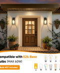 Built Like A Tank Dusk To Dawn Outdoor Wall Light 13 Inch Waterproof Sconce With Smart Sensor by a front door with plants.
