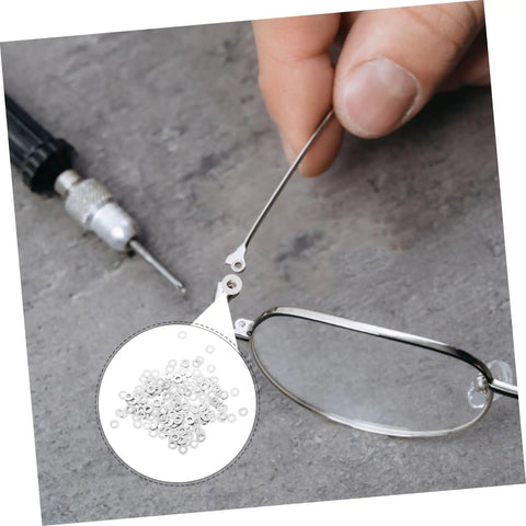 Your Go To Eyeglass Washers Kit With 200 Pcs Rimless Glasses Flat Washers And Metal Fasteners shown in repair process