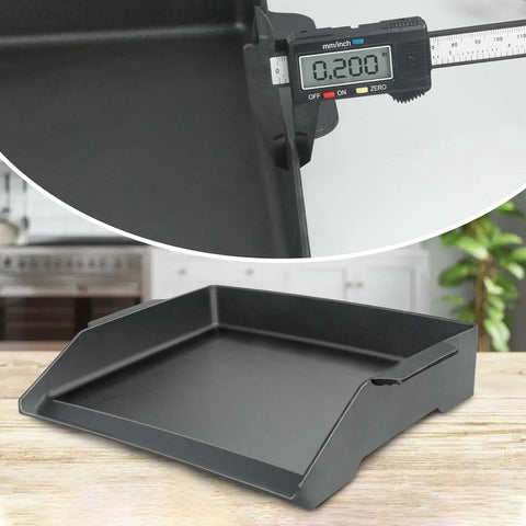 Close-up of a 17 by 13 inch cast iron griddle for gas grills and stovetops, showcasing thickness and matte surface texture.