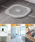 Square Silver Grey Hair Drain Catcher With Strong Suction Cup, a grid design on a wet floor drain.