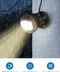 Lit 20W Outdoor COB Landscape Spotlight With Dusk To Dawn Sensor mounted on wall, emitting light in rain, IP65 waterproof, 120V.