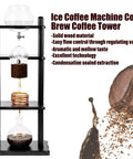 Heavy Hitter Cold Brew Coffee Maker In Handcrafted Glass And Wood Tower Featuring Advanced Slow Drip Tech For Silky Smooth Iced Coffee And Zero Fuss Large Batch Brewing Done Right with gravity-fed extraction.