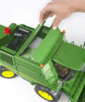 Hand removing grain tank from John Deere T670i Combine Harvester Toy For Kids With Ackermann Steering Tow Bar Realistic Farm Tractor Playset