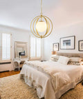 Bedroom with Gold Orb Chandelier 1 Light Globe Pendant Fixture With White Globe Glass Lampshade For Dining Room, Living Room, Bedroom, Foyer, Kitchen Island, Dope Modern Chic Ceiling Light hanging above bed