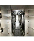 Interior view of Heavy Duty Steam Bottle Sleeve Label Shrinking Machine With 5.6FT Heat Tunnel and 24KW Generator showing the conveyor path.