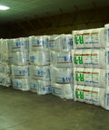 Premium R38 Kraft Faced Fiberglass Insulation Bulk Pack Fits 2X12 Bays For Attic And Wall Projects stored in bundles.