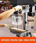 Beastly 13 Inch Floor Drill Press With 7.5 Amp 120V Pure Copper Motor in use on wood, highlighting variable speed from 288 to 308 RPM