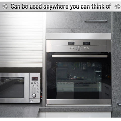 Front view of stainless steel built-in oven with control panel, adjacent stainless microwave in a modern kitchen.