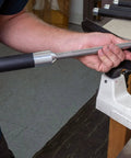 Three-piece carbide woodturning tool set with foam-grip handle mounted on lathe, side view