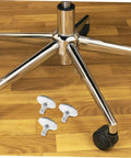 Heavy Duty Adjustable Chair Leveler Pads Set Of Five Swivel Roller Bases on a wooden floor under chair legs.