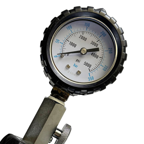 Scuba diving pressure gauge with black protective bezel, showing 0–5000 psi / 350 bar and metal valve connector.