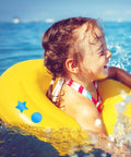 Child playing in water with inflatable ring, showcasing pool fun and safety, related to Blue Rectangle Patch Vinyl Liner Repair Kit For Above Ground Pools 49 By 34 Inch With Heavy Duty Adhesive Patches For Quick Leak Repair And Long Lasting Seal On Pool Liners.