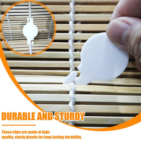 Image of a hand holding a white clip for securing pull cords on bamboo blinds, part of 20 Pack String Clips For Roll Up Shades Compatible With Radiance Bamboo Blinds Heavy Duty Cord Holders To Tame Those Pesky Pull Cords On Your Patio Shades Keep Everything Locked Down Snappy And Tangle Free Always.