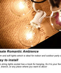 Outdoor String Light Set G40 100 Feet With 105 Edison Glass Bulbs, glowing bulb close-up on brown background