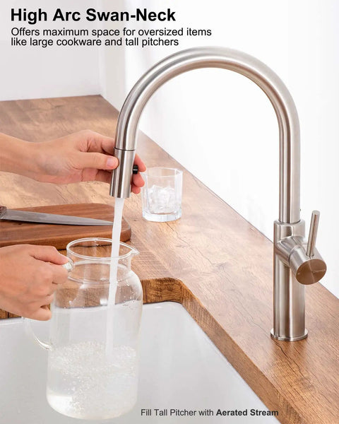 High Arc Kitchen Faucet With Pull Down Sprayer and Magnetic Docking Brushed Nickel Finish in use filling pitcher