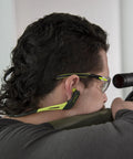 Person using Wave Banded Ear Plugs With Flexible Neckband For Easy Access Gray Yellow Noise Reduction To 22dB Solid Hearing Protection For Work