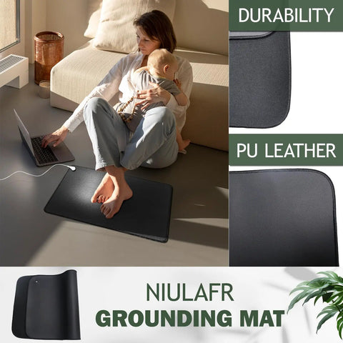 Woman using laptop with baby on All In One Grounding Mat Kit With 15Ft Cord For Foot Mats Computer Desk And Sleep Mat Pet Friendly Super Soft And Cozy Polyurethane Surface