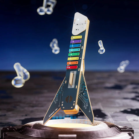 DIY Electronics Guitar Building Kit For Kids 8-12, Hands On STEM Toy with 3D wooden puzzles, colorful keys, and circuits on display.