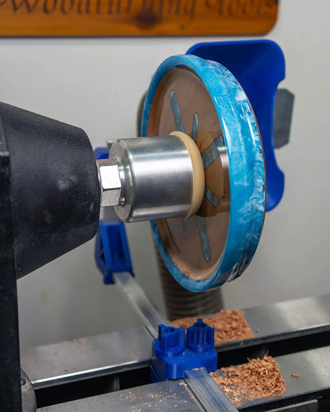 American Made Vacuum Chuck for Woodturning Lathe Bowls, 1 1/4 Inch 8 TPI, 3 1/2 Inch OD, clamping a blue wooden bowl.