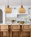 Hand Woven Rattan Pendant Light With Sturdy Wood Frame, 15 Inch Boho Ceiling Fixture For Kitchen Island And Dining Room, showcasing cozy lighting over a kitchen island.