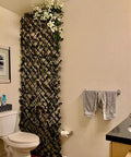 Expandable Faux Ivy Fence Privacy Screen For Patio And Outdoor Spaces with willow wicker in bathroom setting