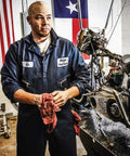 Rugged Men Long Sleeve Coveralls Built Like A Tank With 75 Oz Twill Mechanic Jumpsuit Featuring Zipper Front Industrial Overalls Gray worn by a mechanic in a shop.