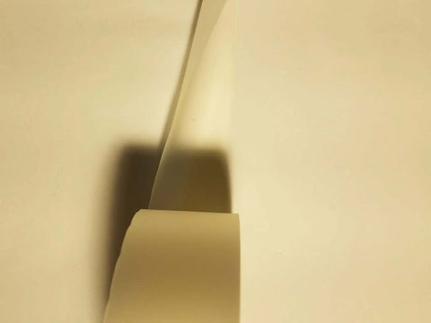 Close-up of Two Inch By Zero Point Zero One Five Inch By One Hundred Foot Urethane Die Protection Film for press brake jobs.