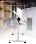 Mobile Adjustable Standing Desk With Scratch Resistant White Maple Surface And Sturdy Metal Base Rock Solid Height Adjustable Mobile Workstation For Home Office Or Study Hassle Free Setup Smooth Glide Wheels in a modern kitchen.