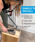 Person installing Retractable In Drawer Power Outlet With Four AC Outlets Brushed Stainless Steel in a kitchen drawer.