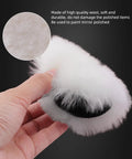 Close-up of Dope 7 Piece Six Inch Wool Polishing Pad being held, showing soft white wool texture for car polishing and buffing.