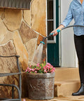 Person using Heavy Duty Swivel Watering Wand for Garden Hose With 5 Spray Patterns, Built From Durable Metal With Zinc Coupling