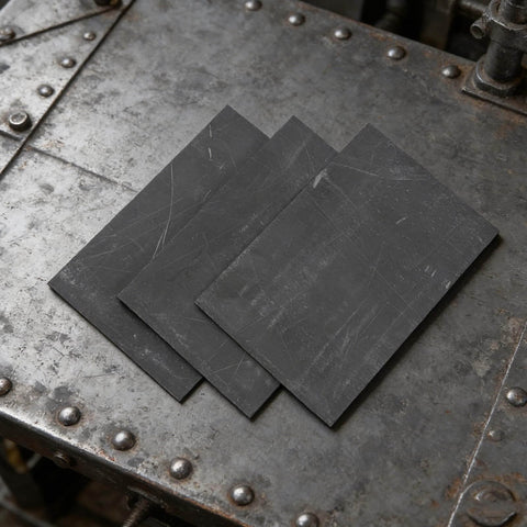 Three Piece Graphite Ingot Block Set With Rectangular Graphite Plates For Electroplating Casting And Electrolysis Metal Melting And Workshop Use 15 By 10 Cm And 5.9 By 3.4 Inches High Purity With Heat Retention displayed on workshop table