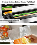 Close-up of double heat seal in use on 95kPa Vacuum Sealer With OneTouch Auto Vac And Seal, sealing bag with salmon and lemon slices.