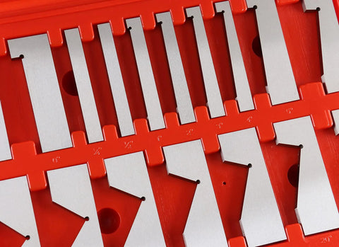 Close-up view of Accusize 17‑pc precision angle block set in a red storage tray with silver metal blocks.