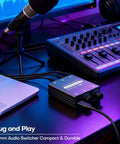 Two Channel 3.5mm Stereo Audio Mixer With Dual Volume Knobs Aluminum Shell 2 In 1 Out connected to laptop and audio gear