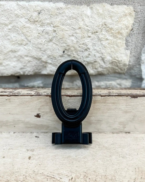 Rodeo Breakaway Honda Black Single Durable ABS Plastic Easy Snap In Place No Rope Cutting Device on wooden surface