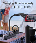 Road Ready Type One J1772 V2L Adapter For Hyundai Kia Genesis EVs With Sixteen Foot Cord charging devices at a beach setup.