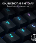 Close-up of Top Tier Mechanical Gaming Keyboard With Kickass Clicky Green Switches exhibiting durable Doubleshot ABS keycaps.