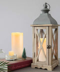 Outdoor Flameless Candles 8 by 4 Inch Waterproof Pillar Set of 2 decorating a wooden lantern with remote control and timer