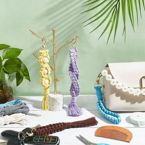 8 Set DIY Macrame Wristlet Keychain Kit For Adults Colorful Macrame Cord Knotting Boho Tassel Keychains on display with accessories
