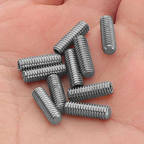 Close-up of Ten Piece Full Thread Socket Set Screw Kit With Metal Cone Point Grub Screws And Hex Socket Head in hand