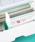 Big League Permanent Adhesive Refill Cartridge For 5 X 18 Foot Creative Station and Studio Lite in machine, ready for crafts.