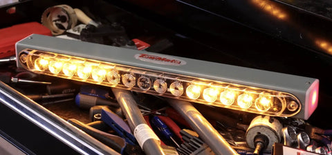 Advantage Wireless Tow Light Bar 22 Inch LED Magnetic Trailer Light Kit on a workbench with tools, illuminated lights, USA made