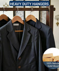 Straight Up Premium Quality Natural Wooden Coat Hangers Thirty Pack Flat Profile Wood Suit Hangers For Suits Jeans Coats And Dresses Anti Rust Metal Hooks Closet Flex with heavy duty suits displayed.