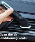 Using Four Pack Microfiber Duster Brush Set for Keyboards Phones Cars and More on car air conditioning vent