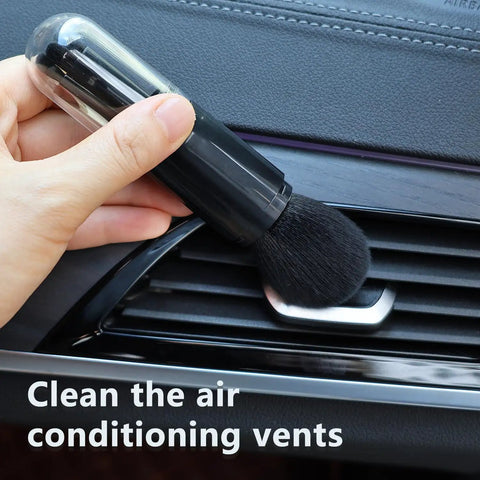 Using Four Pack Microfiber Duster Brush Set for Keyboards Phones Cars and More on car air conditioning vent