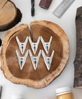 Super Heavy Duty 12-Pc Metal Spring Clamps Kit With Tough White Tips Perfect For Woodworking, DIY Panels, And Backdrop Stands To Hold Projects Steady In Home Shop Or Studio Setting, white tip clamps on wood slices